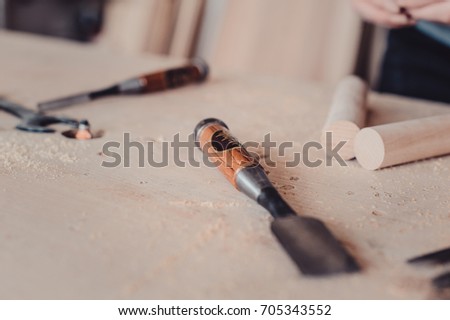 carpenter chisels on the table in the process of making furniture. close