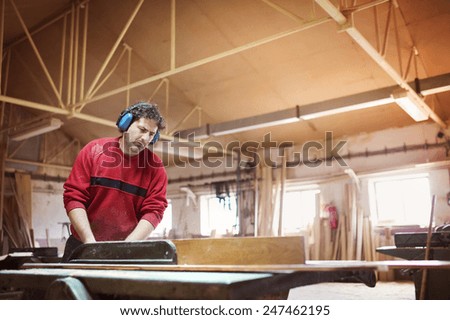 Similar – Image, Stock Photo The worker cuts the parquet on a circular saw