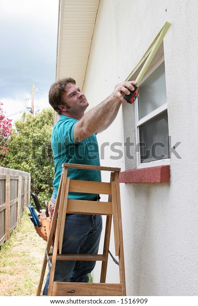 Carpenter Handyman Measuring Windows Storm Shutters Stock Photo Edit Now 1516909