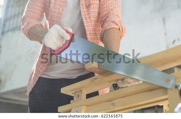 Carpenter Holding Hand Saw On Work Stock Photo Edit Now 622161875