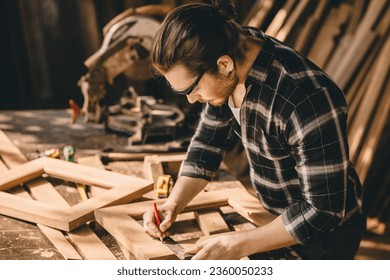 Carpenter Joiner man making wooden furniture in wood workshop professional high skill real authentic handcrafted working people.