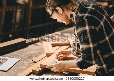 Carpenter Joiner man making wooden furniture in wood workshop professional high skill real authentic handcrafted working people.