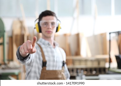 carpenter man touch screen on carpentry background