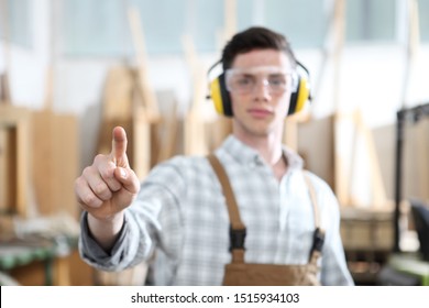 carpenter man touch screen on carpentry background