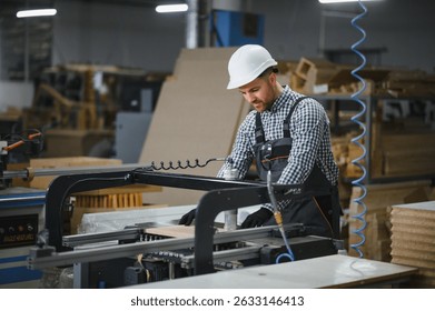 Carpenter operating a cnc machine, crafting wood in a furniture factory, showcasing industrial manufacturing processes
