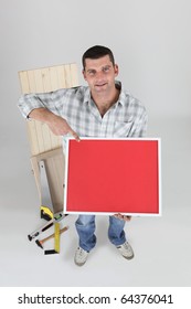Carpenter with red panel on white background