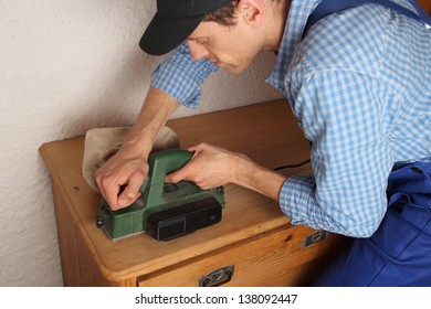 Carpenter Renovating Old Furniture