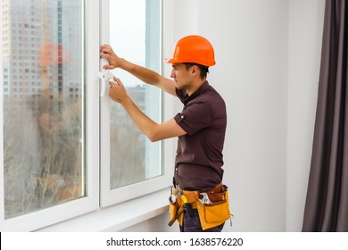 Carpenter repairing window frames, home is being updated to be sold - Shutterstock ID 1638576220