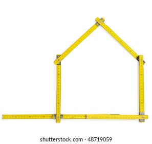 Carpenter rule showing a house shape against white background. With clipping path - Shutterstock ID 48719059