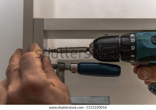 Carpenter Screws Kitchen Cabinets He Fixed Stock Photo Edit Now