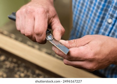 A carpenter sharpens a pencil - Powered by Shutterstock