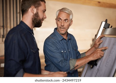 Carpenter, team and men with blueprint for planning project, construction and creative. Architecture, apprentice and mentor with design, drawing and senior father with son for training at workshop - Powered by Shutterstock