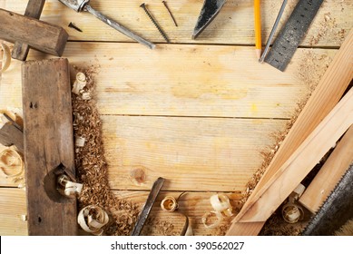 carpenter tools on wood table background