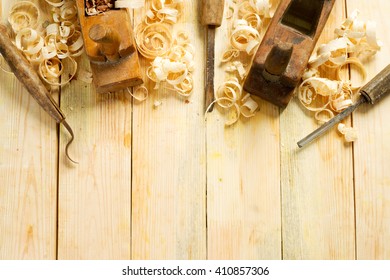 Carpenter tools on wood table background. Top view. Copy space. - Powered by Shutterstock