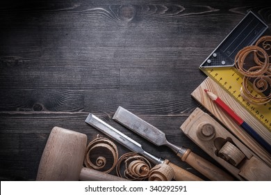 Carpenter tools on wooden board construction concept.