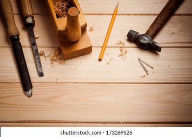 Carpenter Tools In Pine Wood Table