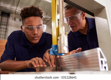 Carpenter Training Male Apprentice To Use Mechanized Saw - Shutterstock ID 531128641