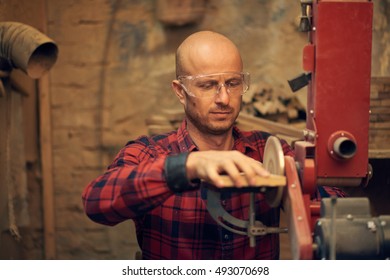 Carpenter using circular sander