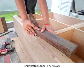  Carpenter Are Using A Router Cutting Edge Smoothing. Carpenters Are Building Furniture.