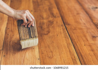 The Carpenter Is Wearing A Polyurethane On A Teak Floor. It Is A Natural Color To See The Beautiful Wood.