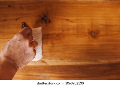 The Carpenter Is Wearing A Polyurethane On A Teak Floor. It Is A Natural Color To See The Beautiful Wood.