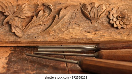 Carpenter Wood Chisel Tool With Carving On Old Weathered Wooden Workbench