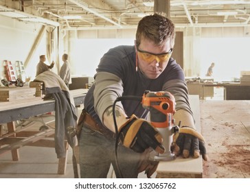 Carpenter At Work At Industrial Job Site