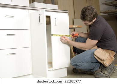 Carpenter at work on job using power tool
