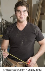 Carpenter at work on job using power tool