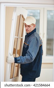 Carpenter Worker At Door Installation