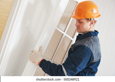 Carpenter Worker At Door Installation
