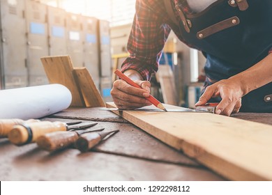 Carpenter working with equipment on wooden table in carpentry shop. woman works in a carpentry shop. - Shutterstock ID 1292298112