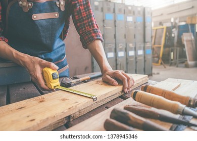 Carpenter working with equipment on wooden table in carpentry shop. woman works in a carpentry shop. - Shutterstock ID 1378945346
