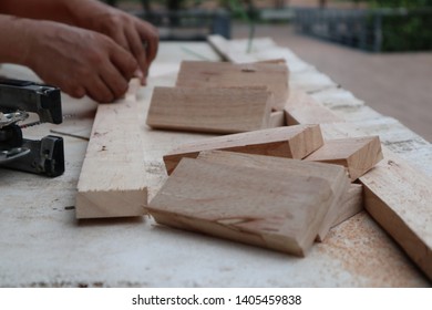 a carpenter working with jig saw and wood