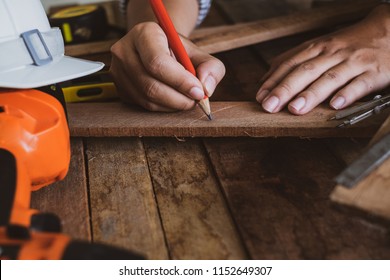 carpenter working, on construction background