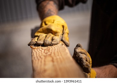 Carpenter Works With Old Reclaimed Oak Wood Beam To Build A Double Bed