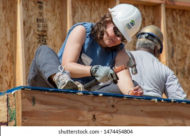 Carpenter Works On Building Roof Of New Home For Habitat For Humanity Charity On Jan 11, 2011