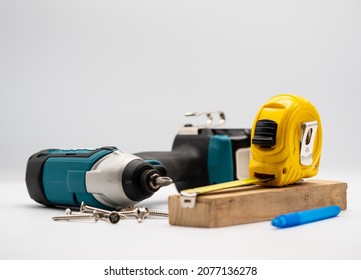 The Carpenter Workshop's Workplace Drills, Electric Drill, Tape Measure, Ruler With Scale, Pencil Instruments For The Joinery Worker