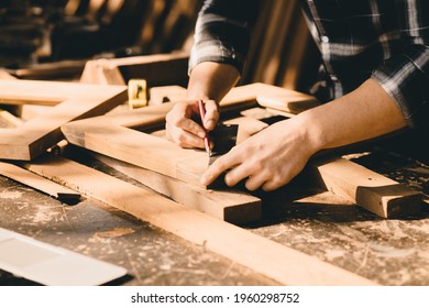 The carpenters high experienced wood worker making furniture. master of woodcraft male work with wooden handcraft piece with fine detail.