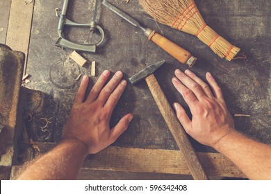 Carpenter's Little Working Tools On A Dusty Table.