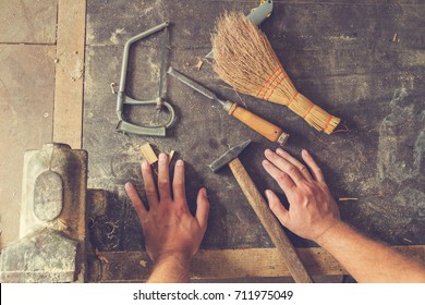 Carpenter's Little Working Tools On A Dusty Table.