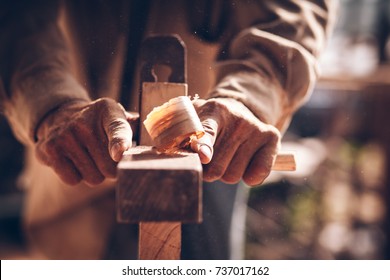 The carpenters are using spokeshave to decorate the woodwork. - Shutterstock ID 737017162
