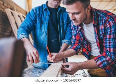 Carpenters at work, constructing and working with wood