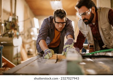 Carpenters working in their woodworking workshop - Powered by Shutterstock