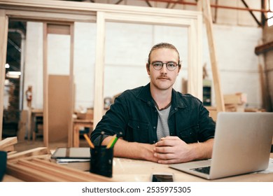 Carpentry, laptop and portrait of man in workshop for inventory, building and furniture production. Woodworking business, warehouse and carpenter on computer for timber, lumber and online orders - Powered by Shutterstock