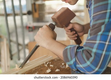 Carpentry Professional, Asian Young Man, Male Carpenter Use Machines Or Tool, Shavings Rugged On Wood, Timber In Small Shop. Woodwork, Furniture Making, Construction Industry. Owner Small Business.