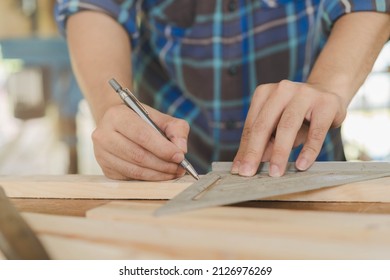 Carpentry Professional, Hand Of Asian Young Man, Male Carpenter Use Ruler Measure, Tool On Board Wood In Small Shop. Woodwork, Furniture Making, Construction Industry. Owner Small Business People.