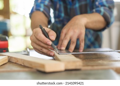 Carpentry Professional, Hand Of Asian Young Man, Male Carpenter Use Ruler Measure, Tool On Board Wood In Small Shop. Woodwork, Furniture Making, Construction Industry. Owner Small Business People.