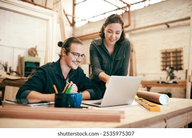 Carpentry, teamwork and people on laptop in workshop for timber, lumber and furniture manufacturing. Construction business, woodworking and man and woman on tech for online order, meeting or planning - Powered by Shutterstock