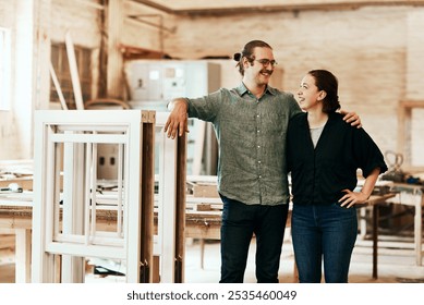 Carpentry, warehouse and couple in workshop with wood for manufacturing, teamwork and furniture production. Woodworking, collaboration and man and woman for timber, lumber and construction business - Powered by Shutterstock